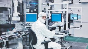 Employees in the fab manage the tools in the clean room. Each tool performs a step toward creating a chip on a wafer in the manufacturing process.