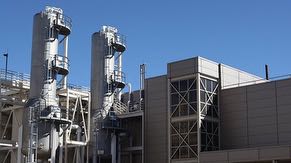 West side of Central Utility Building (CUB) with view of gas towers and ultrapure water (UPW) tanks.